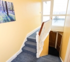 Hallway and staircase in plymouth university shared student flat.
