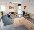 Open plan modern kitchen dining area in plymouth university shared flat.
