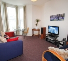 Large communal lounge with sofas in Plymouth University 1 bed student flat.